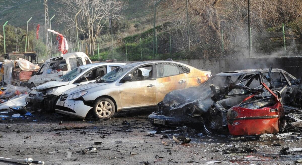 The remains of cars are pictured Monday after a car bomb went off at the Cilvegozu border crossing between Turkey and Syria.