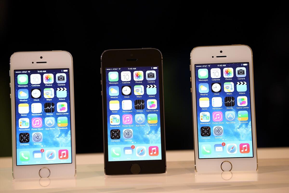 The new iPhone 5s is displayed during an Apple product announcement.