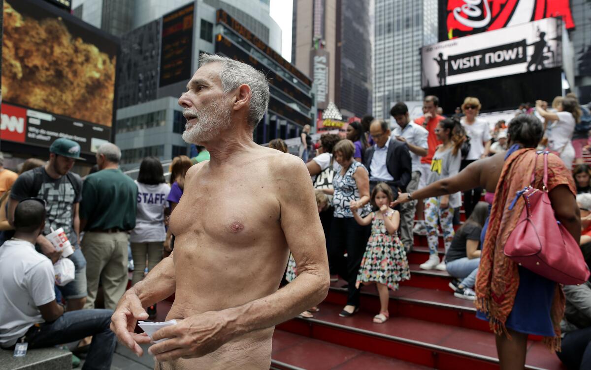George Davis, a candidate for the San Francisco Board of Supervisors, makes a speech in the nude in Times Square 