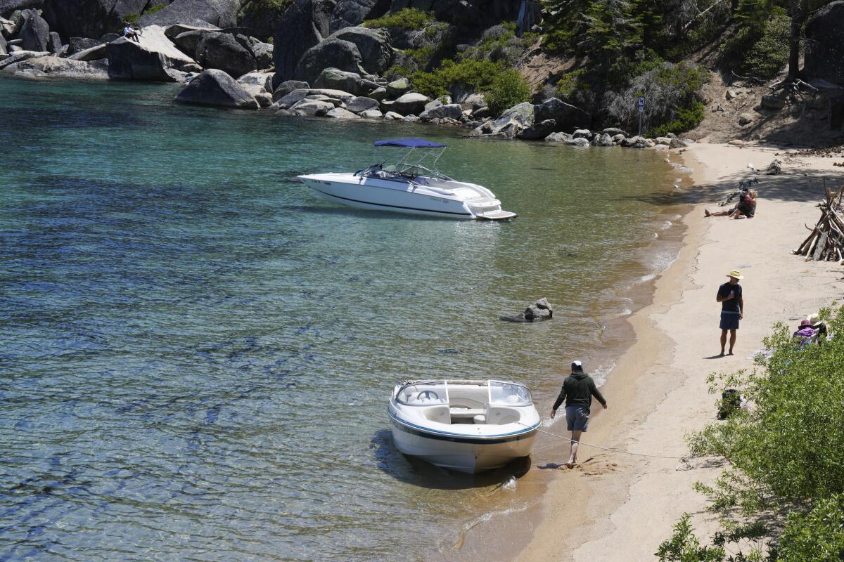 Visitors along the lake at D.L. Bliss State Park after a weekend incident in which a boat capsized, killing several people.