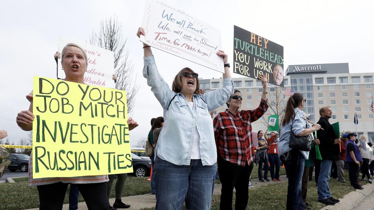 Protesters outside a venue where Senate Majority Leader Mitch McConnell spoke to his constituents Feb. 22 in Jeffersontown, Ky. Republican lawmakers have been met with protests at recent town hall meetings.