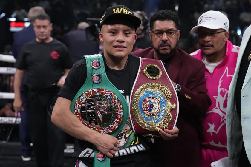Isaac Cruz celebrates winning his lightweight boxing match against Giovanni Cabrera, Saturday, July 29, 2023, in Las Vegas. (AP Photo/John Locher)