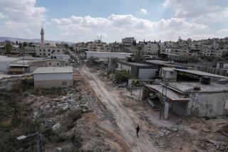 A man walks on a damaged road following an Israeli army raid in Jenin, West Bank, on Wednesday, Sept. 4, 2024. (AP Photo/Majdi Mohammed)