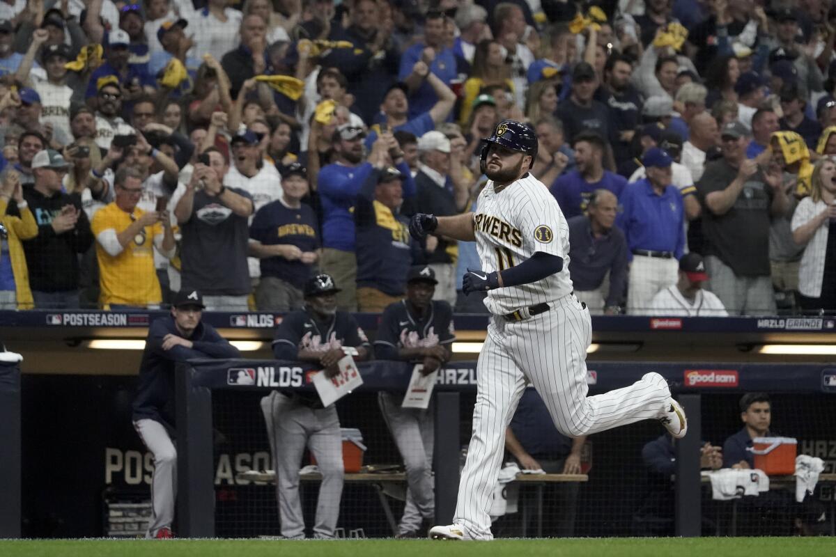The Milwaukee Brewers' Rowdy Tellez celebrates a two-run home run during the seventh inning Oct. 8, 2021, in Milwaukee.