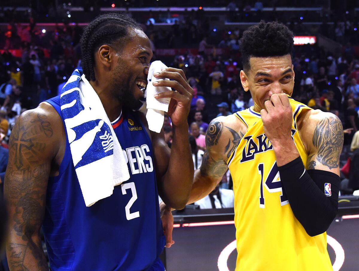 Clippers star Kawhi Leonard Lakers guard Danny Green share a laugh.