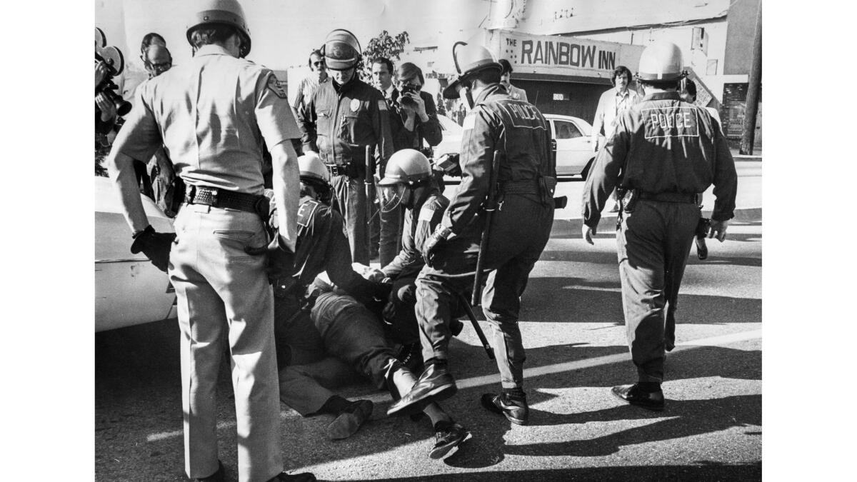 Jan. 30, 1972: An anti-Nazi demonstrator is arrested outside the National Socialist White People's Party headquarters in El Monte. Forty protesters were arrested.