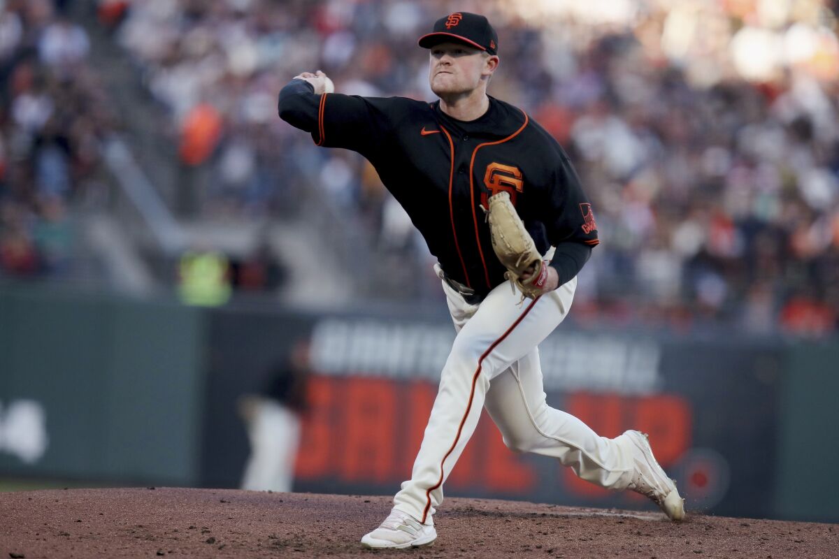 San Francisco Giants starting pitcher Logan Webb throws a pitch during the third inning of the team's baseball game against the Pittsburgh Pirates on Saturday, Aug. 13, 2022, in San Francisco. (AP Photo/Scot Tucker)
