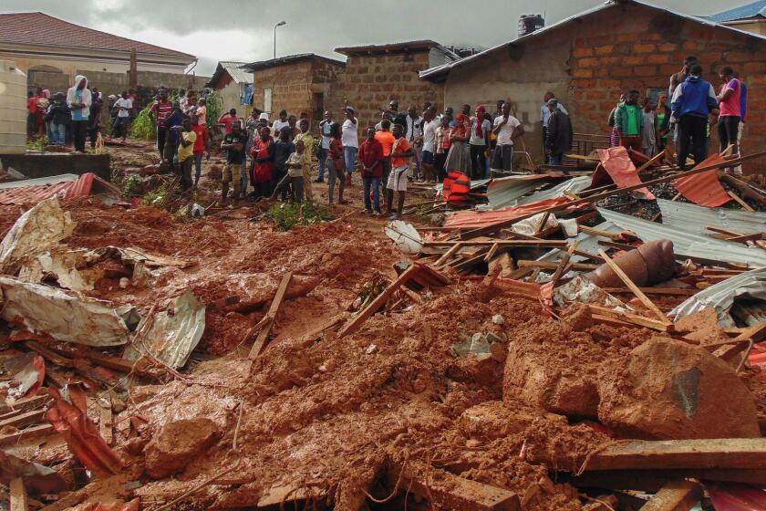 epa06144788 Sierra Leone residents of Freetown view damage to property due to a mudslide in the suburb of Regent behind Guma reservoir, Freetown, Sierra Leone, 14 August 2017.According to news reports citing Sierra Leone's Vice President Victor Bockarie Foh, hundreds are feared dead with thousands displaced after a mudslide in heavy rains occured near Freetown. EPA/ERNEST HENRY ** Usable by LA, CT and MoD ONLY **
