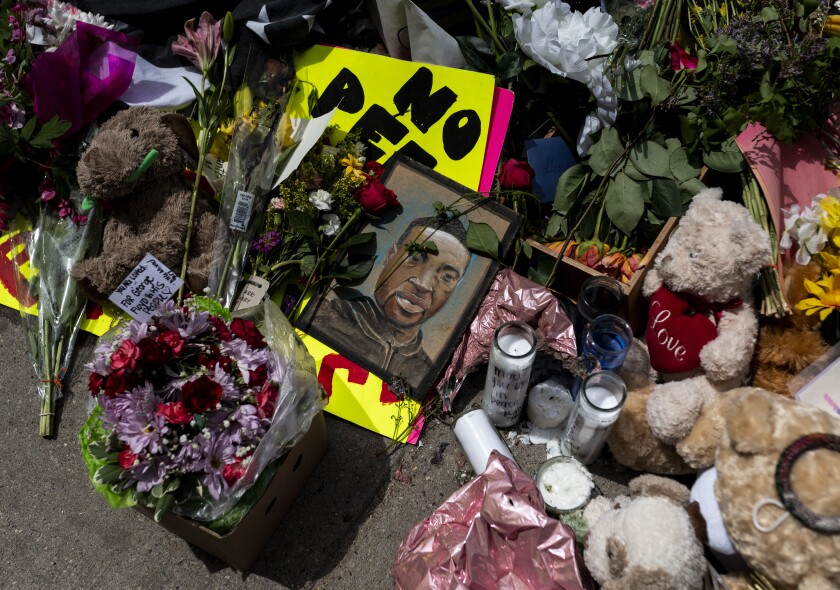 MINNEAPOLIS, MN - MAY 28: A memorial lies outside the Cup Foods, where George Floyd was killed in police custody, on May 28, 2020 in Minneapolis, Minnesota. Rev. Al Sharpton was joined by Gwen Carr, the mother of Eric Garner, and spoke at the site of Floyd's death about the need to hold police officers accountable for their actions. (Photo by Stephen Maturen/Getty Images)