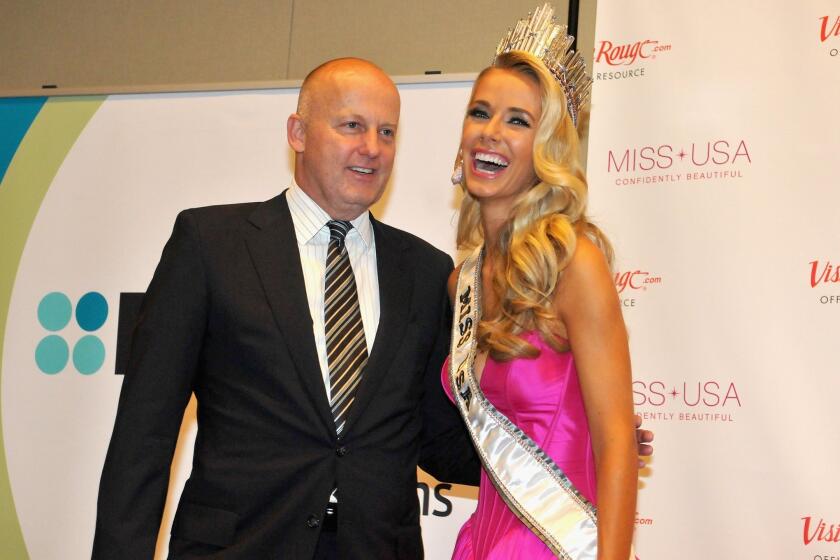 Reelz Chief Executive Stan E. Hubbard poses with Miss USA Olivia Jordan of Oklahoma at the 2015 Miss USA Pageant.