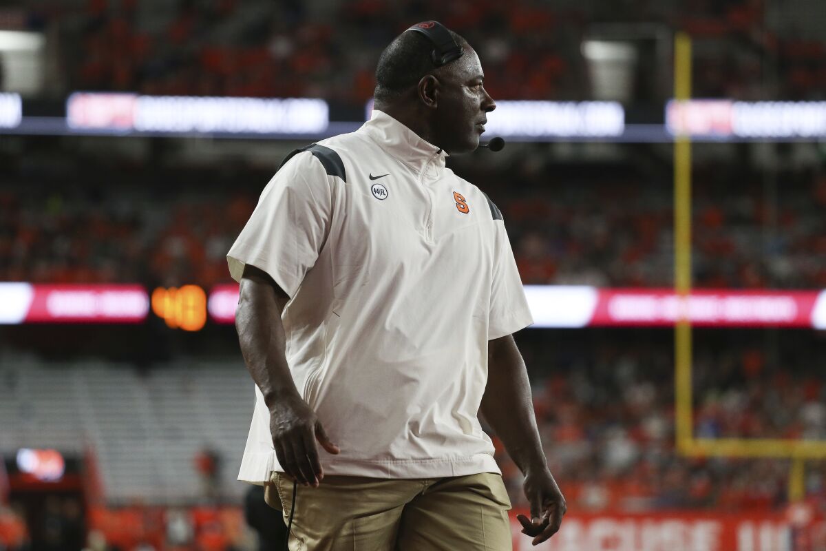 Syracuse coach Dino Babers watches from the sideline during the second quarter of the team's NCAA football game against Clemson in Syracuse, N.Y., Friday, Oct. 15, 2021. (AP Photo/Joshua Bessex)