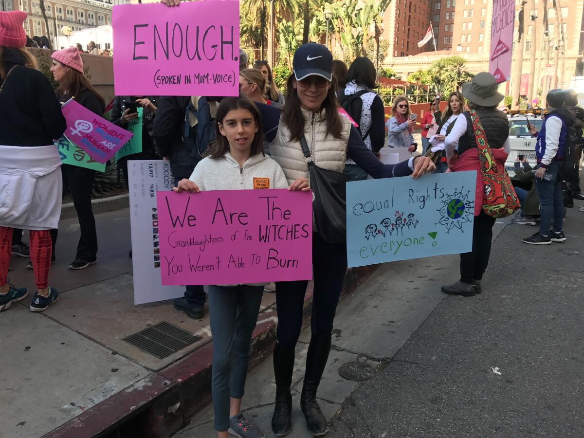 Jennifer Lang, right, and her daughter Sheila attend the Women's March in downtown Los Angeles