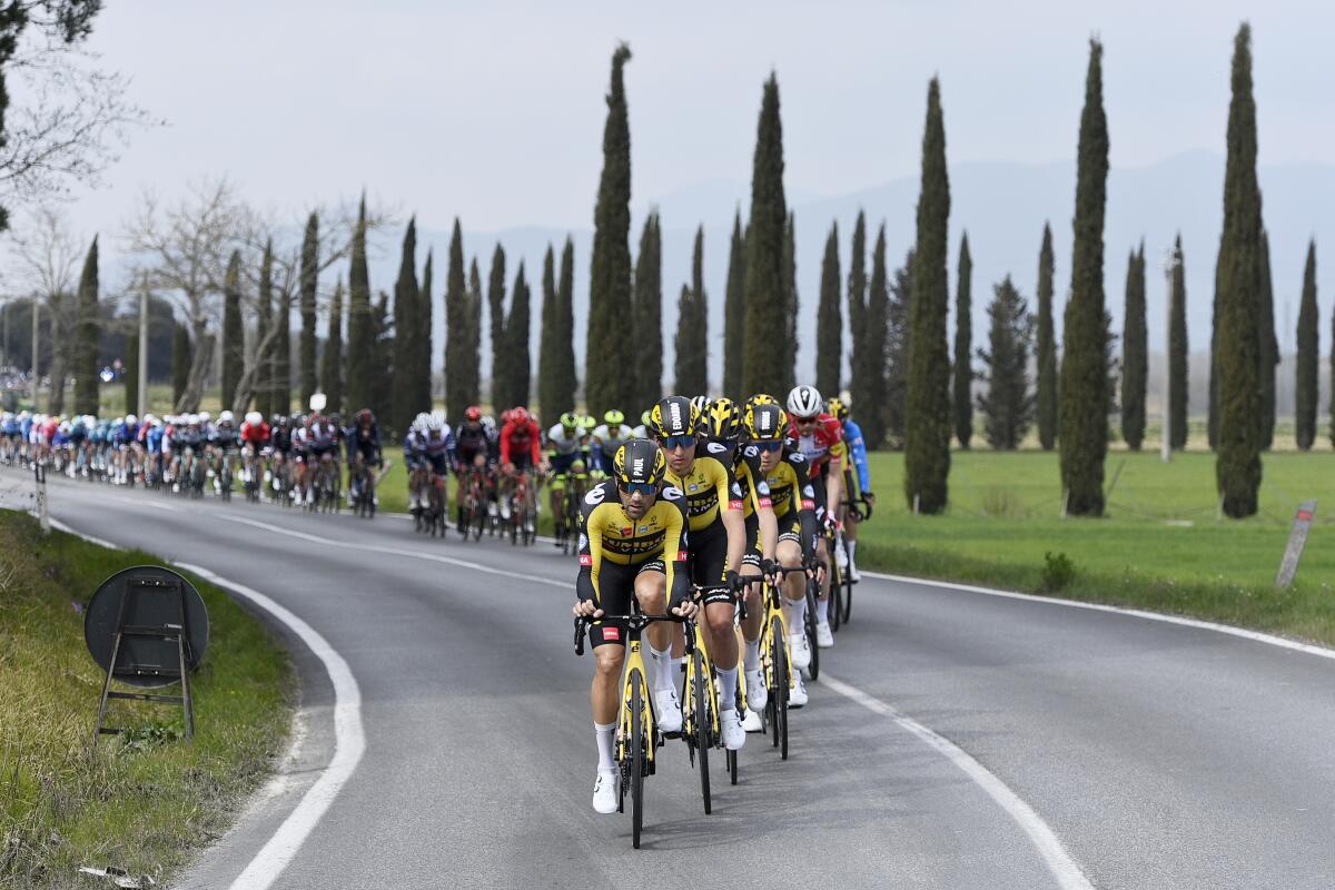 Cyclists pedal during the second stage of the Tirreno Adriatico cycling race, from Camaiore to Chiusdino, Italy, Thursday, March 11, 2021. (Marco Alpozzi/LaPresse via AP)