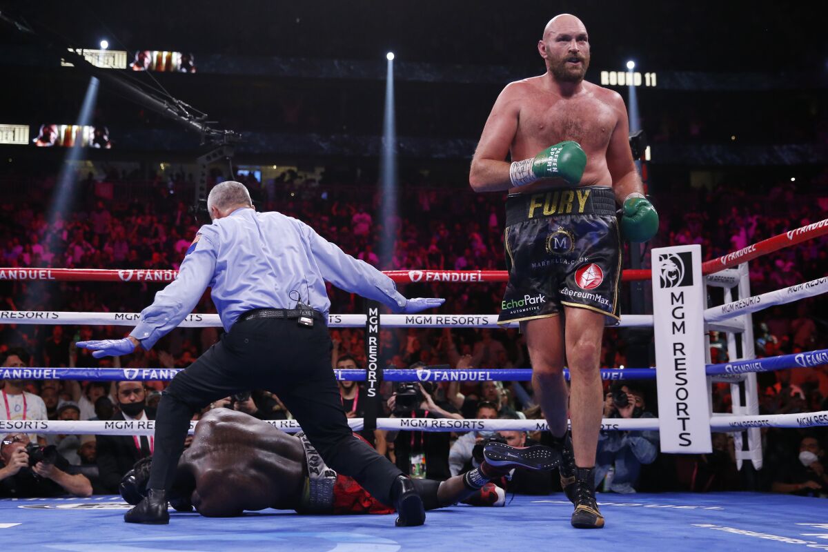 FILE - Tyson Fury, of England, walks away after knocking out Deontay Wilder in the 11th round of a heavyweight championship boxing match on Oct. 9, 2021, in Las Vegas. Wilder and Fury both scored knockdowns early in the third bout in October 2021, but Fury finished Wilder in the 11th. (AP Photo/Chase Stevens, File)