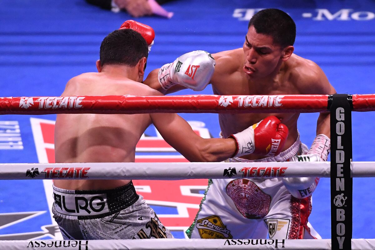 Vergil Ortiz Jr. knocks down Mauricio Herrera in the second round of their welterweight fight May 4 in Las Vegas. 