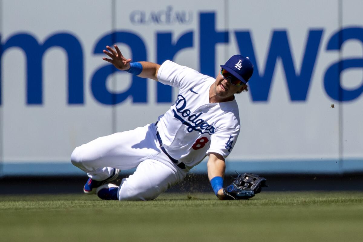 Dodgers right fielder Zach McKinstry makes a diving catch on a fly ball hit.