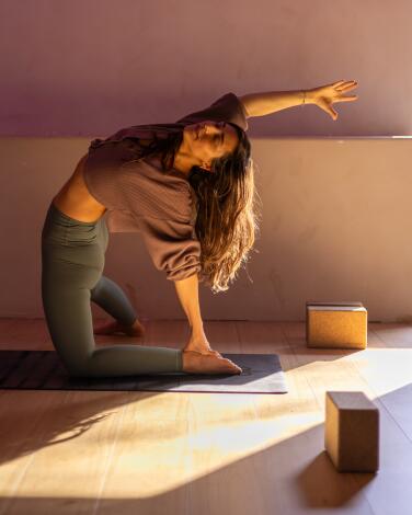 A woman on the floor in a yoga pose