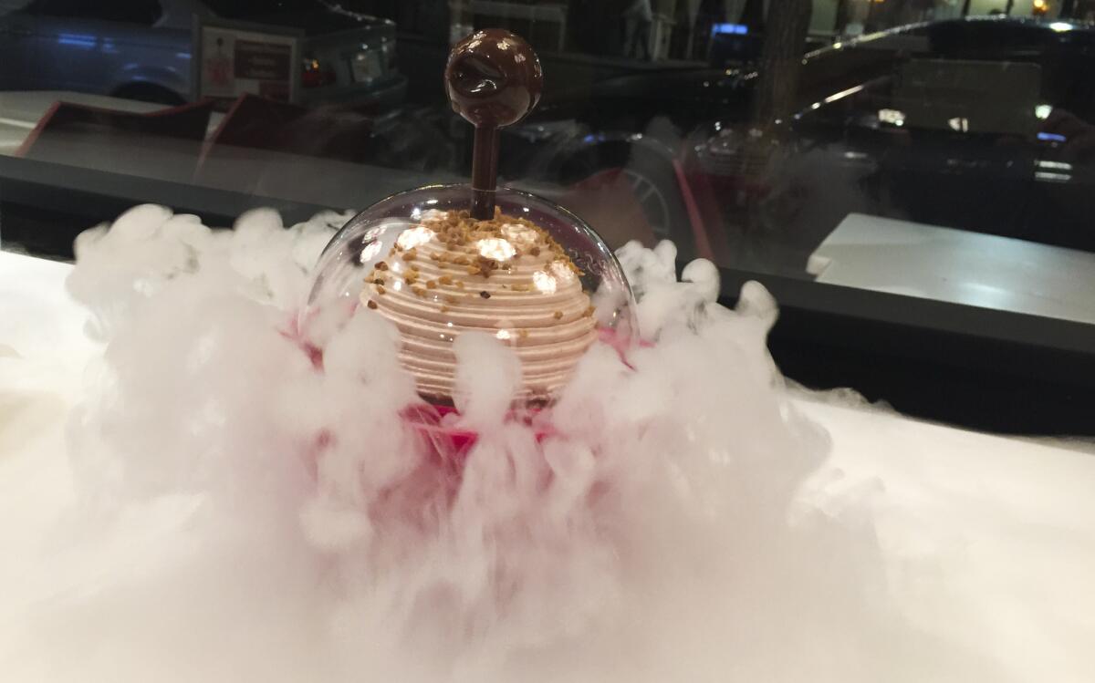 Billowing clouds of dry ice add drama to your meringue-topped gelato if you order the Vegas Bowl at iDessert in Little Italy, San Diego. (Mika Molen-Radcliffe / For The Times)