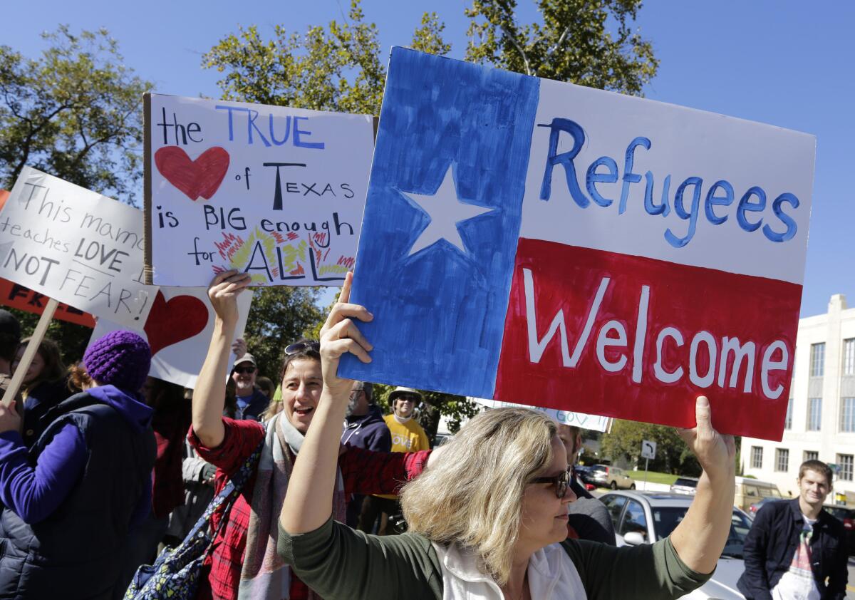 People in Austin, Texas, protest in November against Gov. Greg Abbott's refusal to allow Syrian refugees in the state.