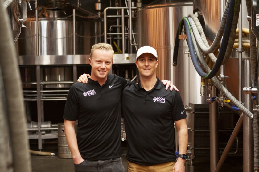 Cousins Joe Carmichael, left, and Ryan White inside their Local Roots Kombucha brewery in Vista.