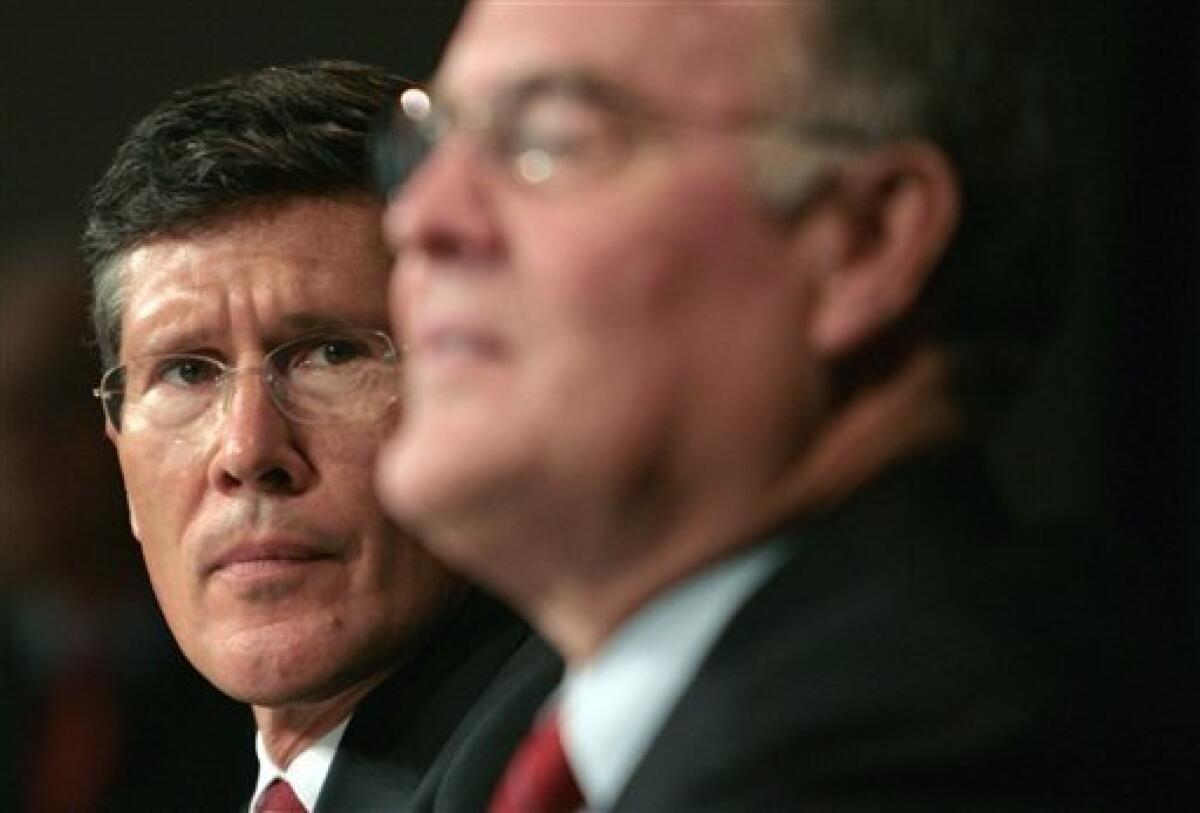 **CORRECTS FOR THEN MERRILL LYNCH CHAIRMAN AND CEO JOHN THAIN In this Sept. 15, 2008 file photo, then Merrill Lynch Chairman and CEO John Thain, left, listens as Bank of America Chairman and CEO Ken Lewis speaks during a news conference in New York. Bank of America Corp. shares fell sharply Thursday, Jan. 22, 2009, after a report that executives are meeting to discuss former Merrill Lynch chief executive John Thain's future with the company. (AP Photos/Bebeto Matthews, File)
