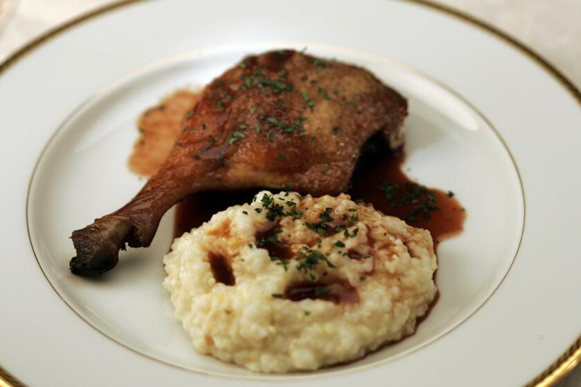 Recipe: Barbecue-braised duck legs with garlic grits