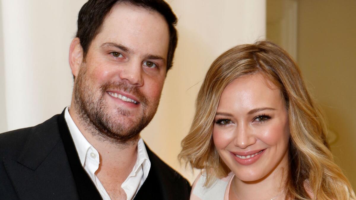 Mike Comrie and Hilary Duff, shown in 2012, split up in 2014 and just finalized their divorce.
