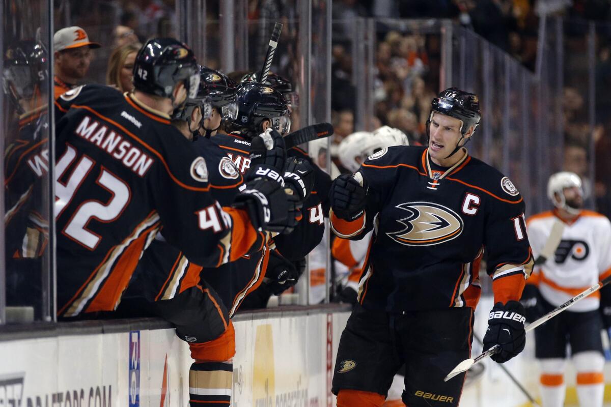 Ducks center Ryan Getzlaf, right, celebrates his goal with teammates during the first period against the Flyers.