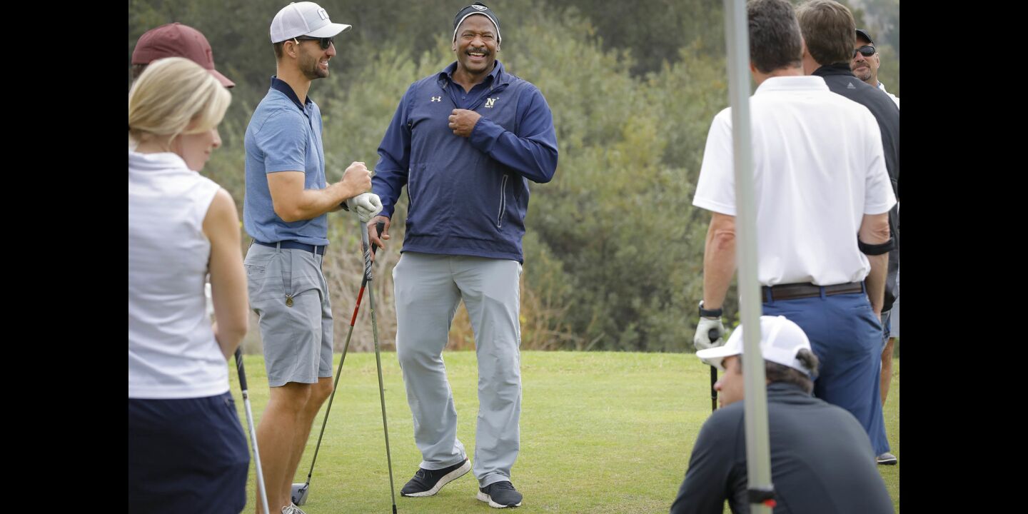 Napoleon McCallum who played football for the U.S.Naval Academy and Oakland Raiders, enjoys a laugh will fellow golfers in the Navy-Notre Dame Golf Tournament at the Riverwalk Golf Club in Mission Valley in advance of the football game between the two schools to be held at SDCCU Stadium, Saturday.