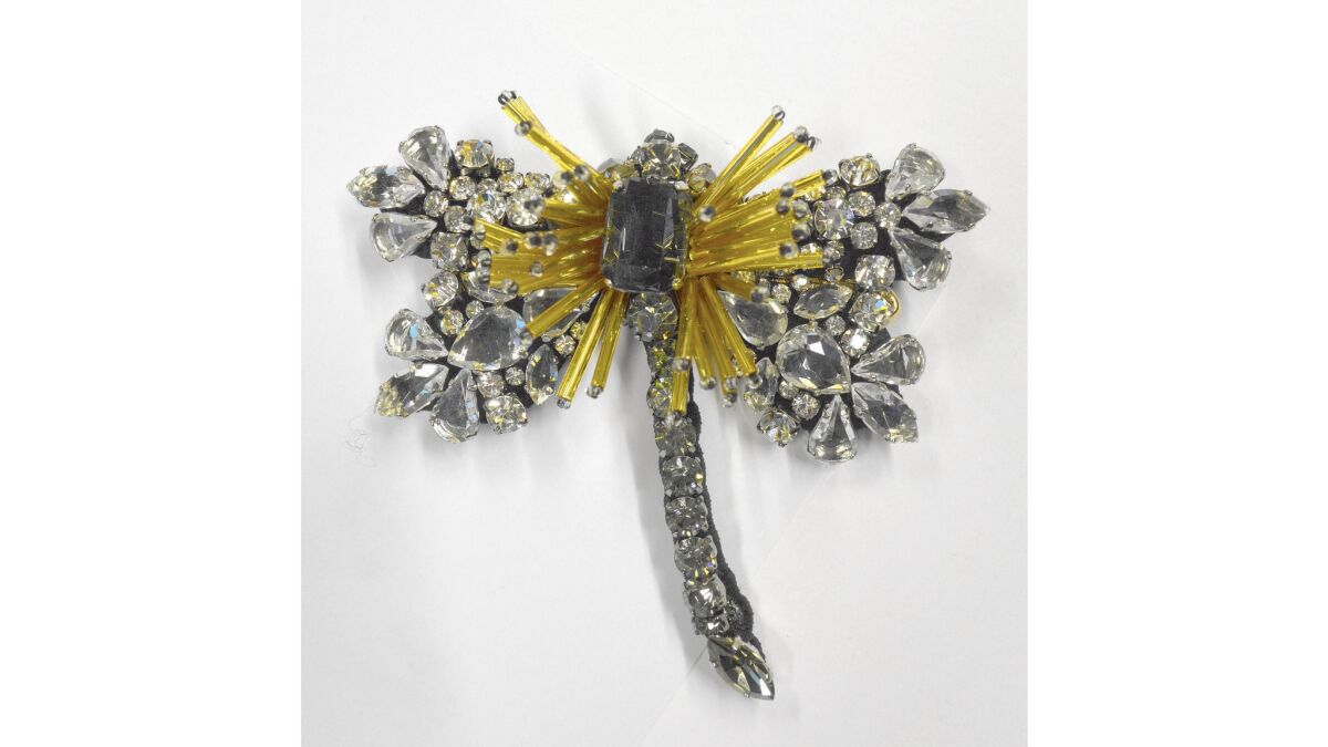 Les Copains dragonfly brooch with beads and crystals, $365 at Saks Fifth Avenue stores, (212) 262-8556 and on Sept. 30 at lescopains.com