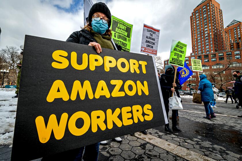 MANHATTAN, NEW YORK, UNITED STATES - 2021/02/20: Participant seen holding a sign at the protest. Members of the Workers Assembly Against Racism gathered across from Jeff Bezos-owned Whole Foods Market in Union Square South for a nation-wide solidarity event with the unionizing Amazon workers in Bessemer, Alabama. (Photo by Erik McGregor/LightRocket via Getty Images)