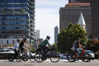 San Diego, CA - April 18: Cyclists ride along Beech Street during the 2024 California Bicycle Summit in San Diego on Thursday, April 18, 2024 in San Diego, CA. (Meg McLaughlin / The San Diego Union-Tribune)