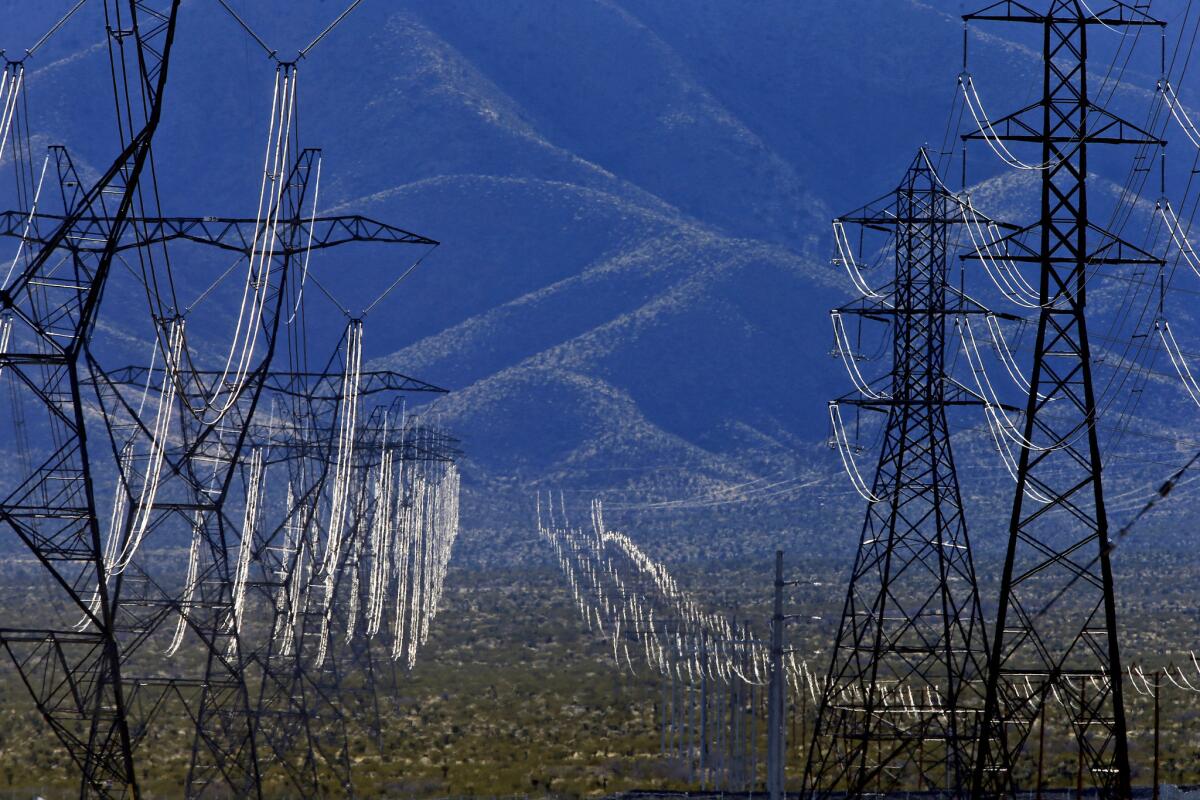 Electrical lines are draped across the Mojave Desert at the Ivanpah Solar Electric Generating System.