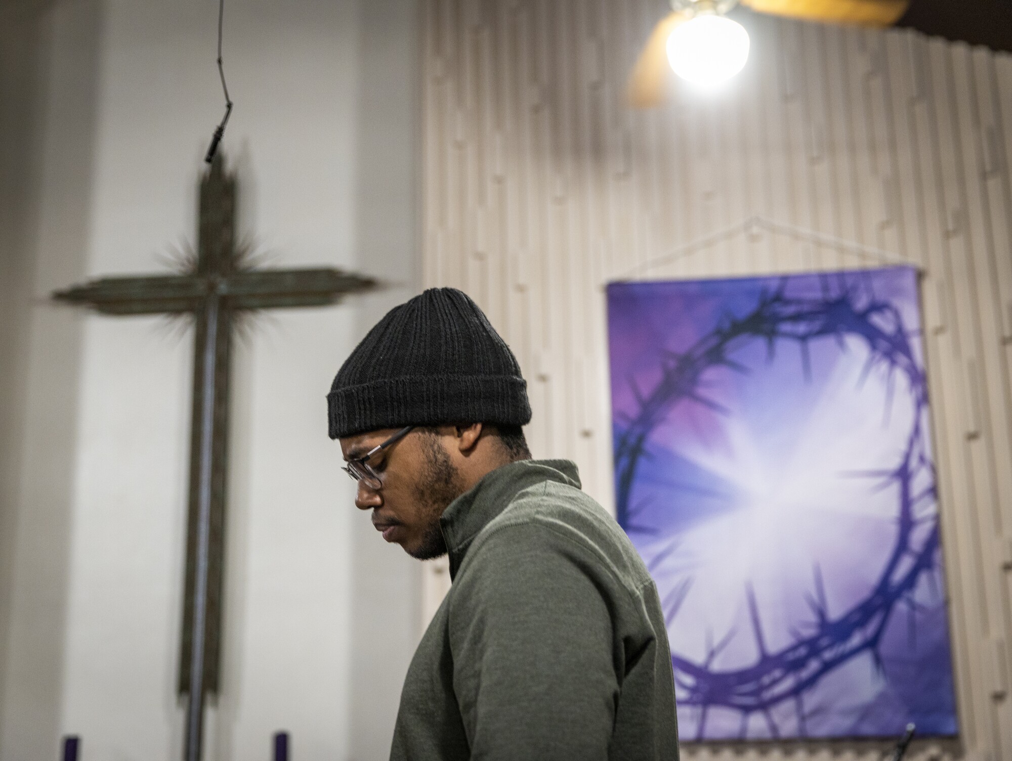 A man pauses during a discussion.