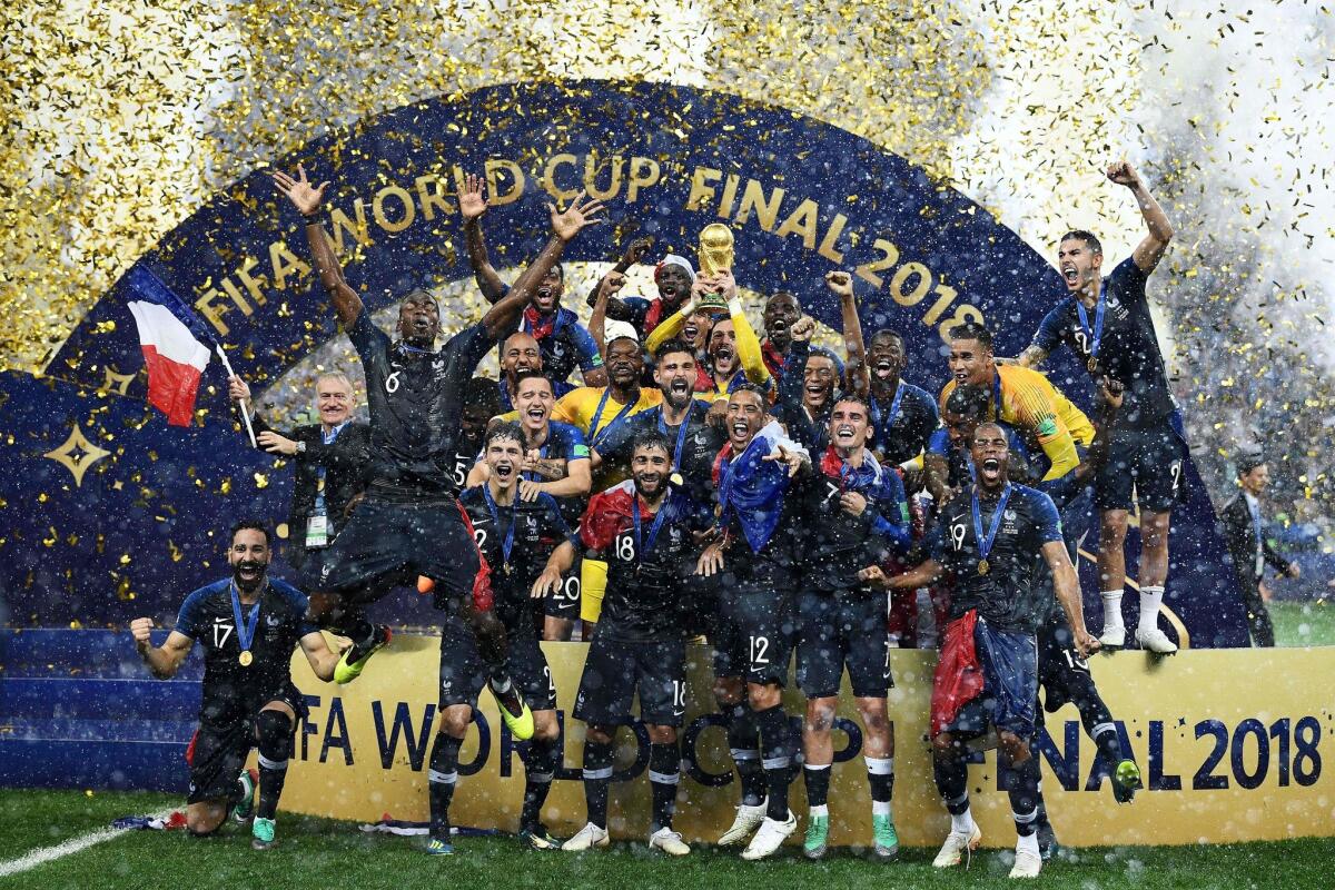 France's players celebrate as they hold their World Cup trophy during the trophy ceremony at the end of the Russia 2018 World Cup final football match between France and Croatia at the Luzhniki Stadium in Moscow.