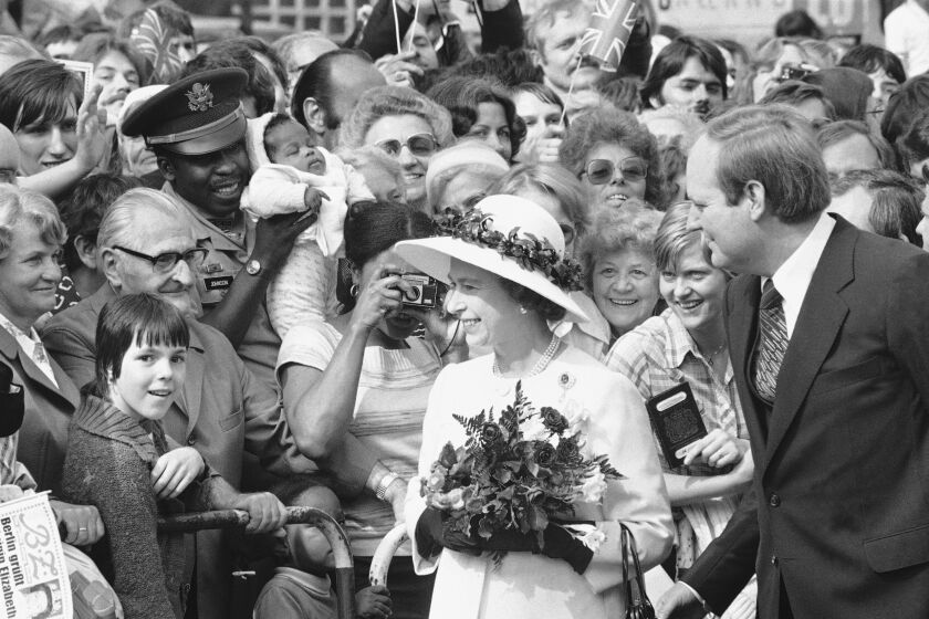 FILE - People gather to greet Britain's Queen Elizabeth II as she walked along the famous Kurfuerstendamm Boulevard in West Berlin, Germany, on May 24, 1978. One would like two horses. That, in effect, was the gift requested by Britain's Queen Elizabeth II during her state visit to Germany in 1978, weekly Der Spiegel reported Monday, March 27, 2023. (AP Photo, File)