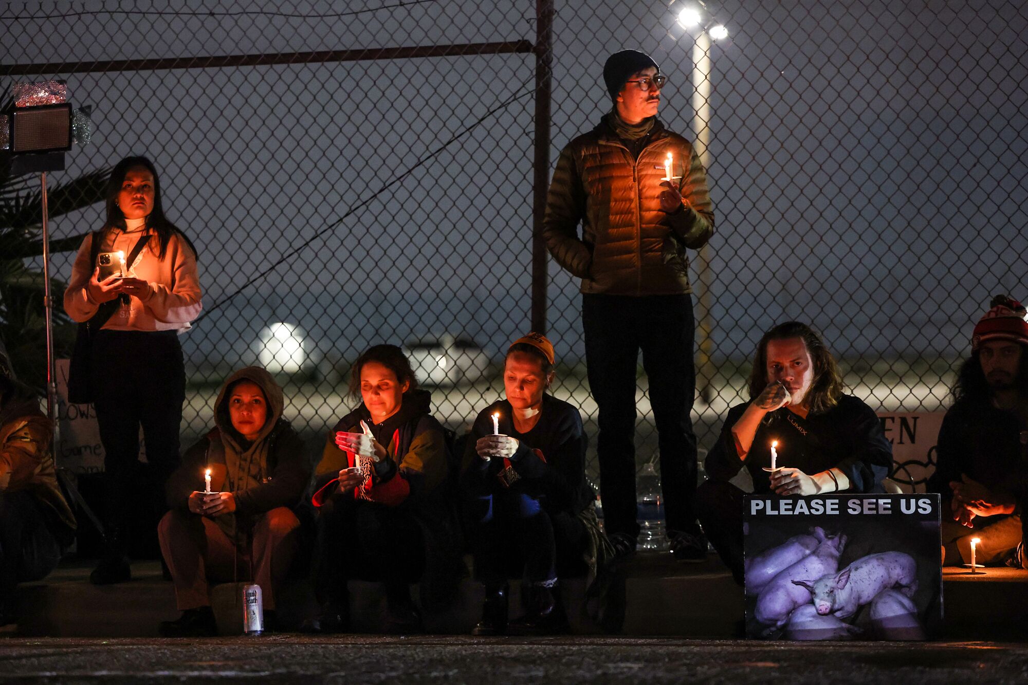 Activists gather one last time in front of Farmer John's meat processing plant.