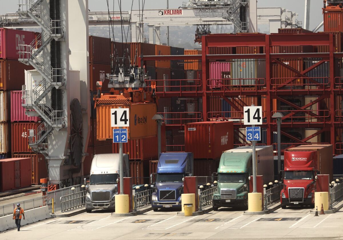 Trucks line up to drop off their loads at the Port of Los Angeles on August 27, 2020.