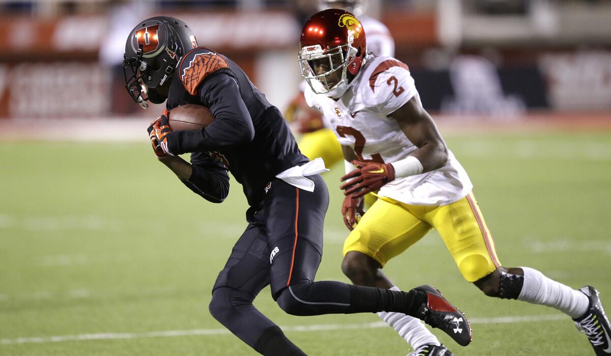 USC cornerback Adoree' Jackson (2), who returned a kickoff for a touchdown in the game, moves in to tackle Utah wide receiver Tim Patrick in the first quarter Saturday night in Salt Lake City.