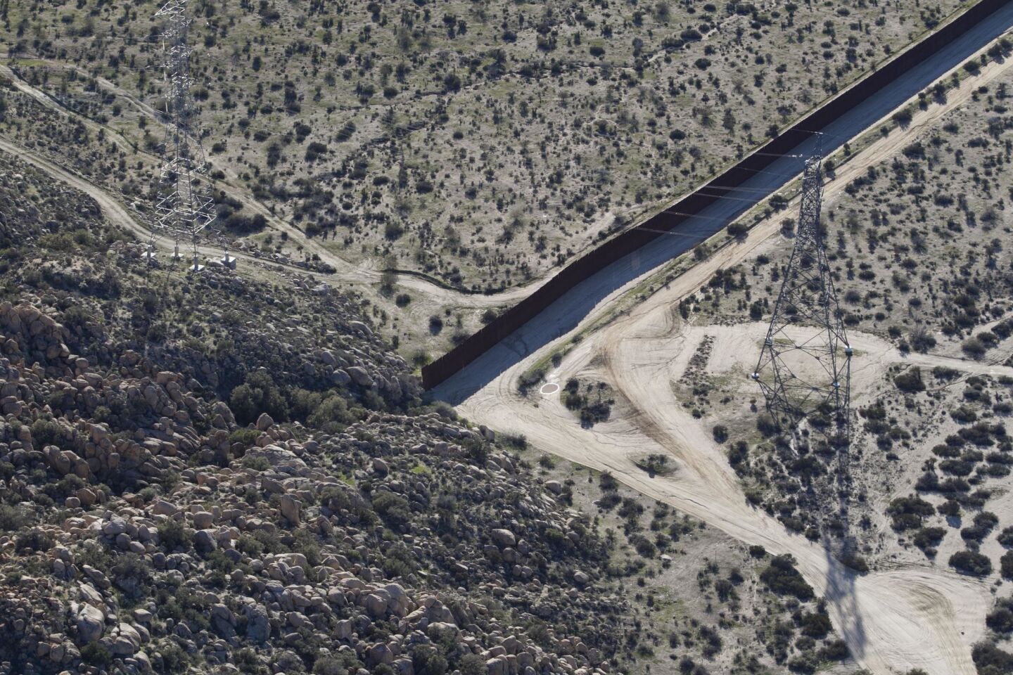 Steep cliffs, rocks and chaparral serve as a natural border wall in some parts of California. This is an aerial view in southeastern Imperial County