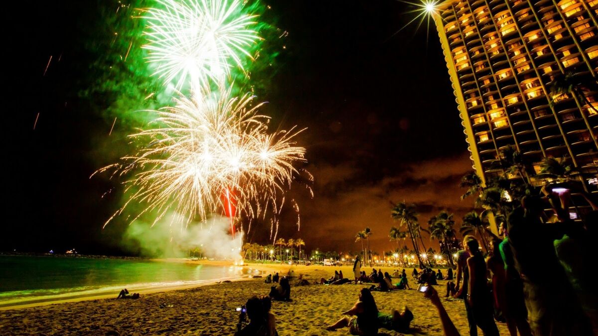 Fireworks explode each Friday evening beside the Hilton Hawaiian Village on Waikiki Beach.
