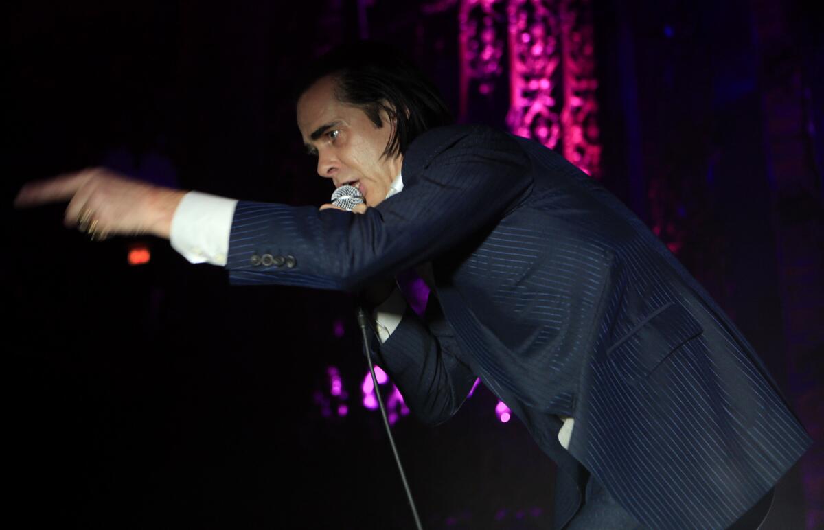 Nick Cave performs with his band, the Bad Seeds, at the new Theatre at Ace Hotel in downtown Los Angeles.