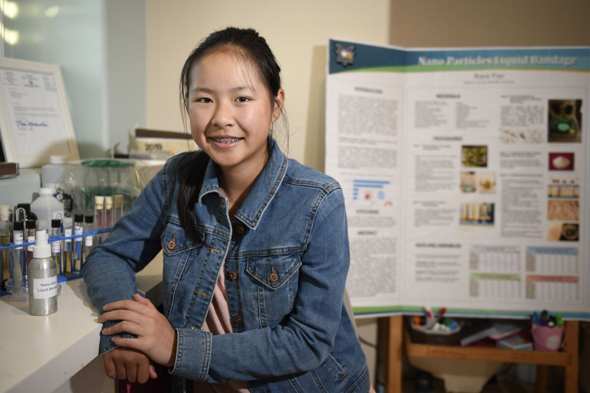 Kara Fan poses in her home laboratory in San Diego, California. Fan won the 2019 3M Young Scientist Challenge.