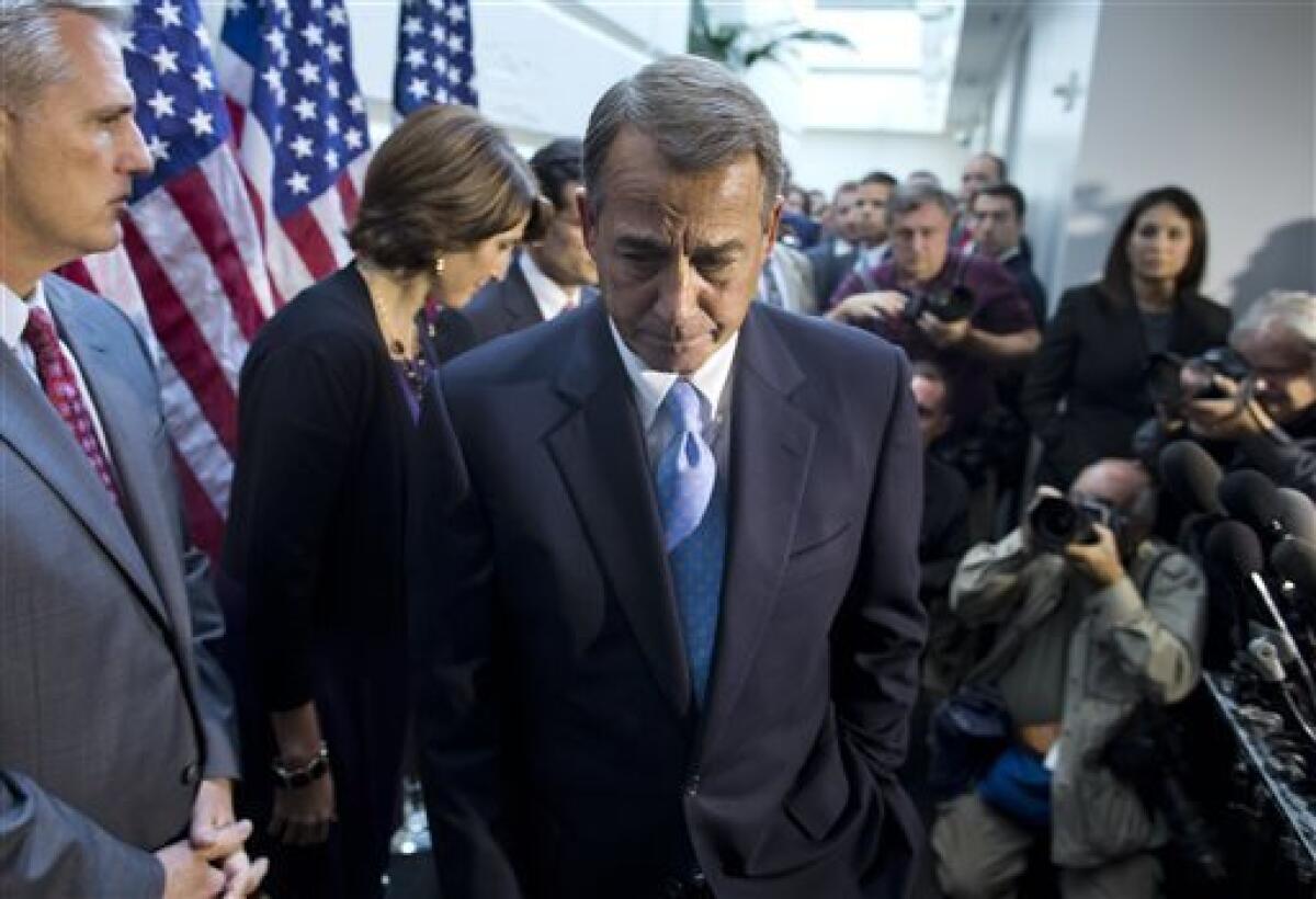 House Speaker John A. Boehner (R-Ohio) leaves a news conference after a House GOP meeting on Capitol Hill. His efforts to craft an alternative to a Senate budget deal collapsed.