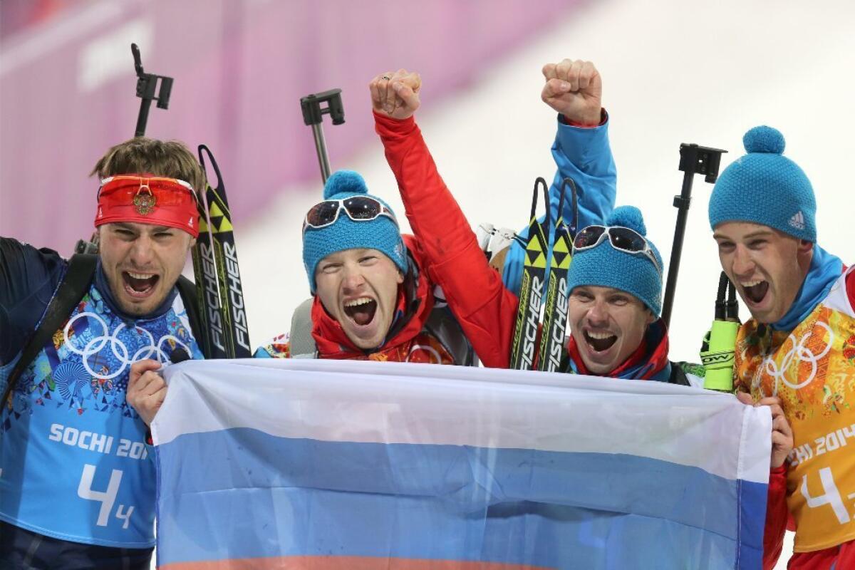 The Russian team celebrates its gold medal.