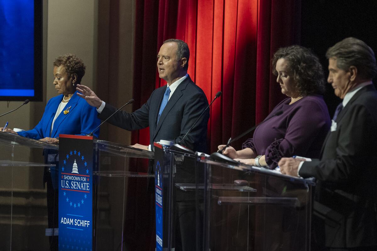 Barbara Lee, left, Adam B. Schiff, Katie Porter and Steve Garvey at lecterns during a debate