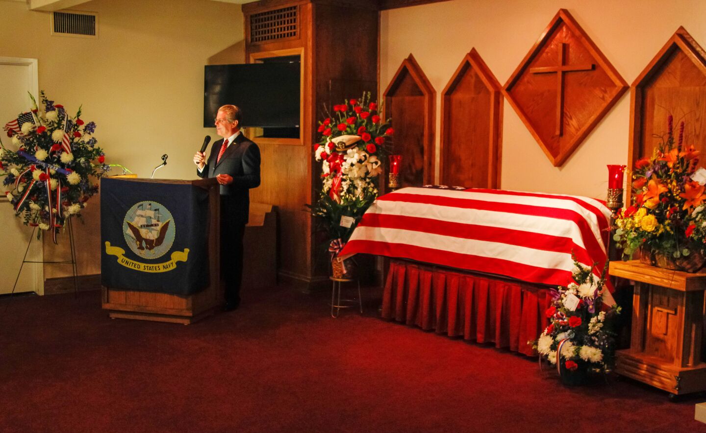 Mac McLaughlin, president and ceo of the USS Midway Museum, speaks during Rudy Matz's memorial service at the Poway Bernardo Mortuary.