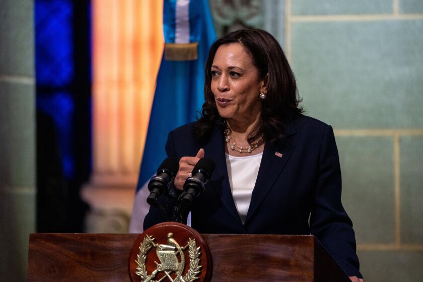 GUATEMALA CITY, GUATEMALA - JUNE 07: Vice President Kamala Harris speaks while Guatemalan President Alejandro Giammattei listens at the Palacio Nacional de la Cultura on on Monday, June 7, 2021. This week, the Vice President is visiting Guatemala and Mexico to discuss the root causes of migration from the Central American countries in what is known as the Northern Triangle - Honduras, El Salvador and Guatemala. (Kent Nishimura / Los Angeles Times)