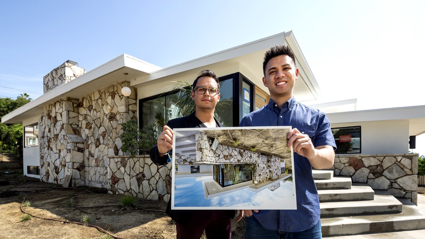 Thomas Bayles, left and his business partner, Alan Quach, at one of the properties they're renovating.