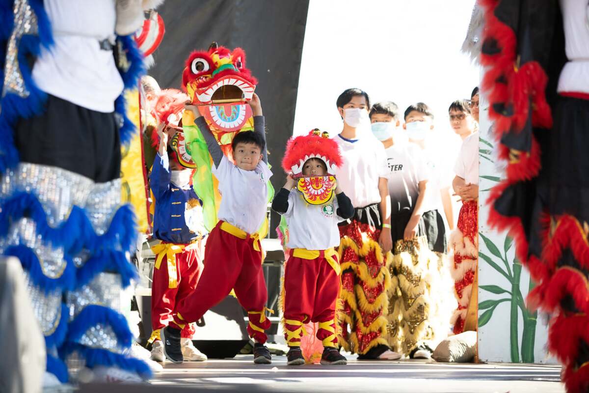 Little lion dancers from the Hoa Nghien Lion Dance troupe get ready to perform in January 2022.